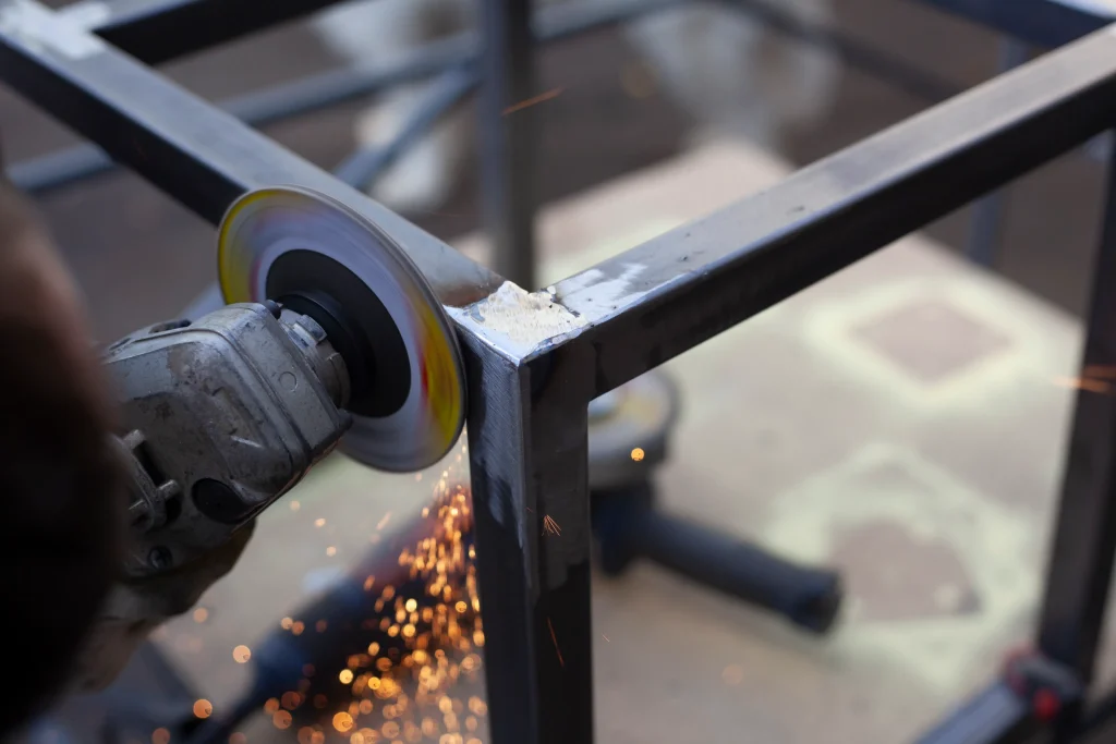2026 08 10T16 19 03.296063Z corner grinding metal processing stripping of seams after welding rotation of disc with abrosive coating grinding of steel profile photo 1