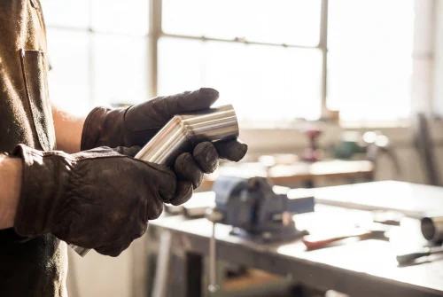2026 08 10T16 26 53.042501Z professional worker hands holding shiny metal pipe photo 1